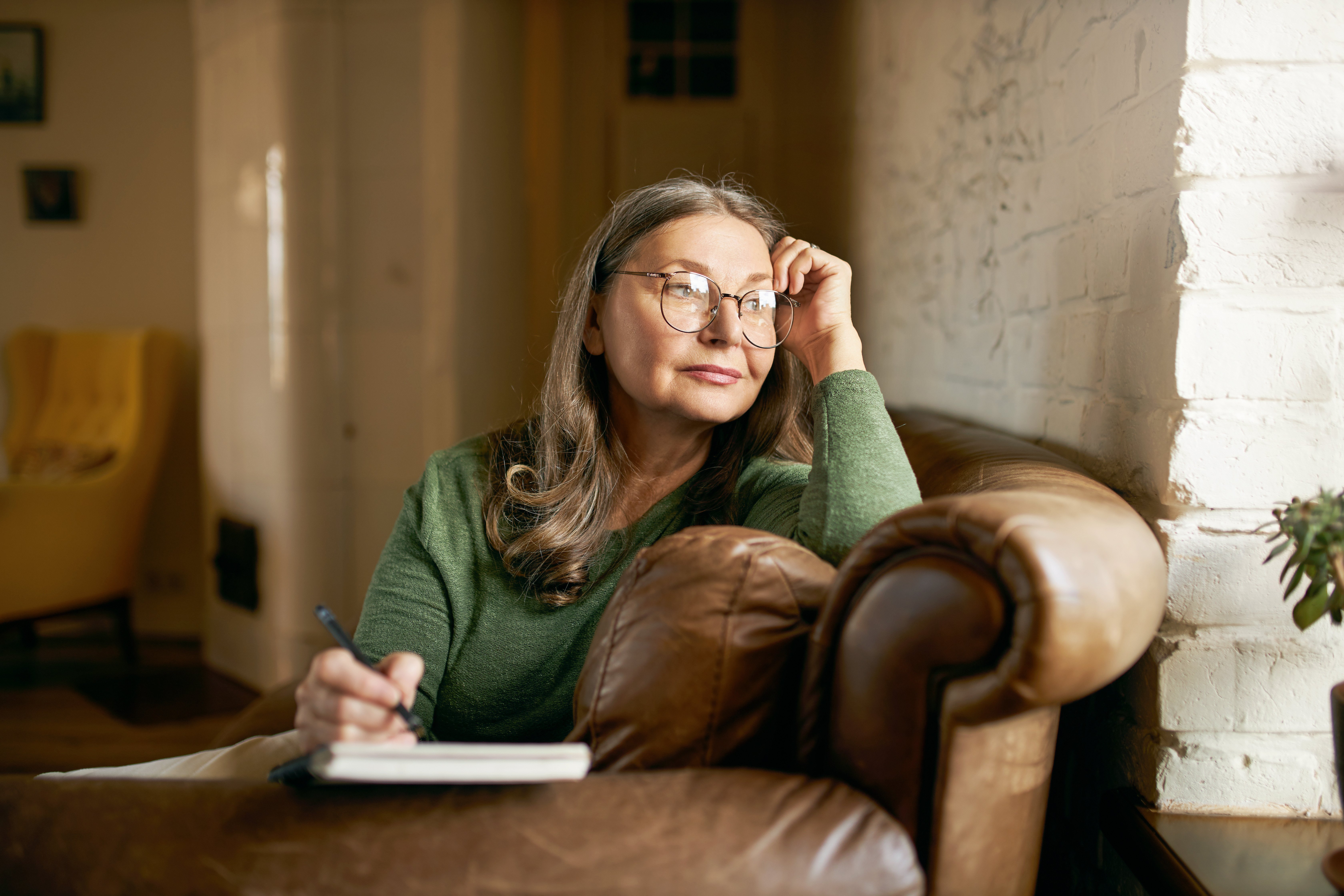 Woman writing in a journal